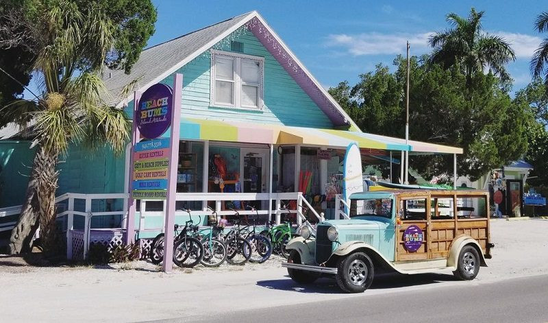 Colorful beach cruiser bicycles lined up outside Beach Bums Recreational Rentals shop, Anna Maria Island
