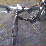 Cyclist preparing to adjust bike brakes