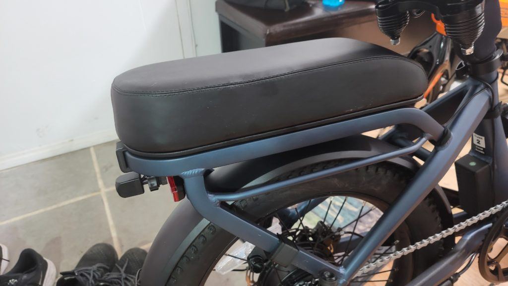 Foldable foot pegs designed for a two person electric bike passenger kit