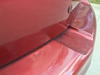 Image showing the dented plastic bumper of the Mazda 3 caused by the Saris Bones 2 hatchback bike rack pressure.