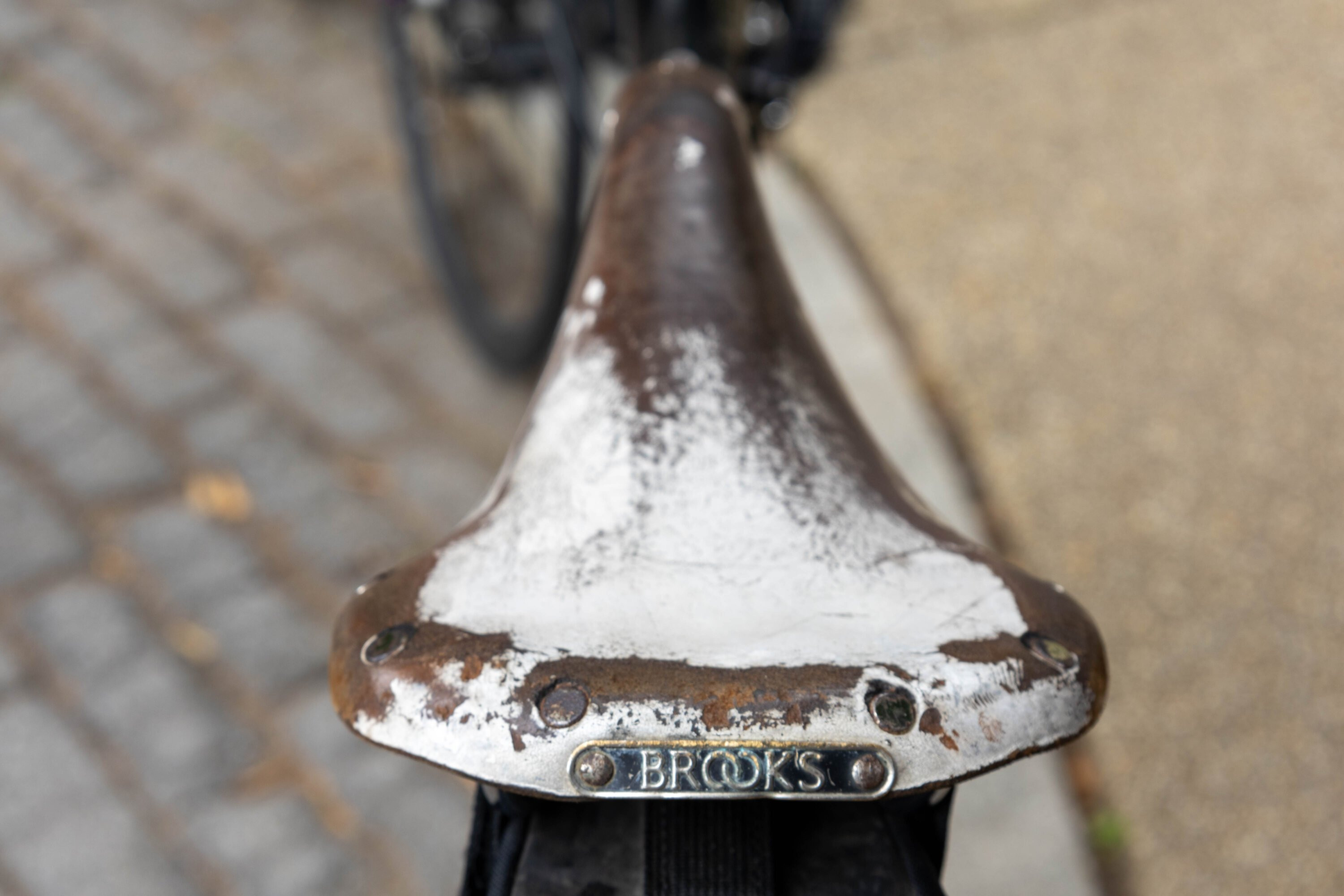 A bike messenger navigates a tight turn during a race.