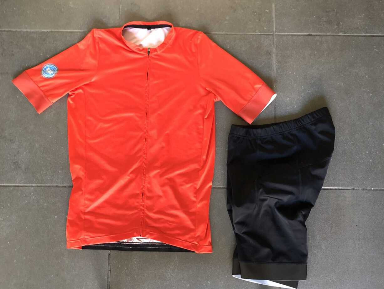 Cyclist in appropriate clothing for 70 degrees Fahrenheit