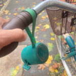 Oliver Keens’ bluetooth speaker, which accompanies him on his bicycle journeys, showcasing a compact audio device attached to a bicycle for playing music while riding