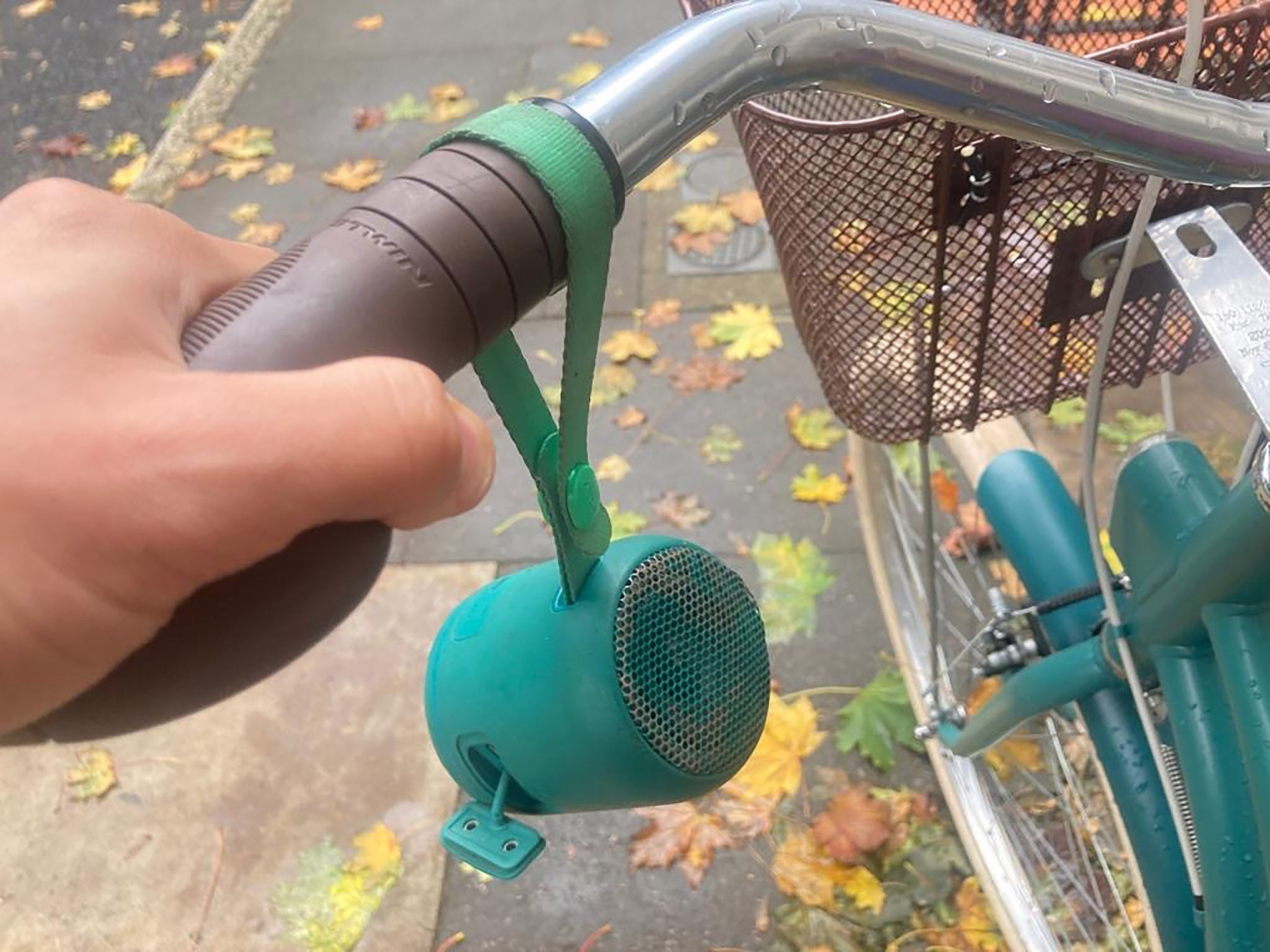Oliver Keens’ bluetooth speaker, which accompanies him on his bicycle journeys, showcasing a compact audio device attached to a bicycle for playing music while riding