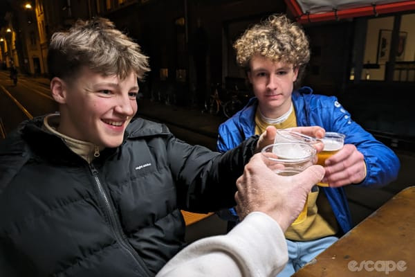 Teenagers enjoying a free beer ride on the beer bike.