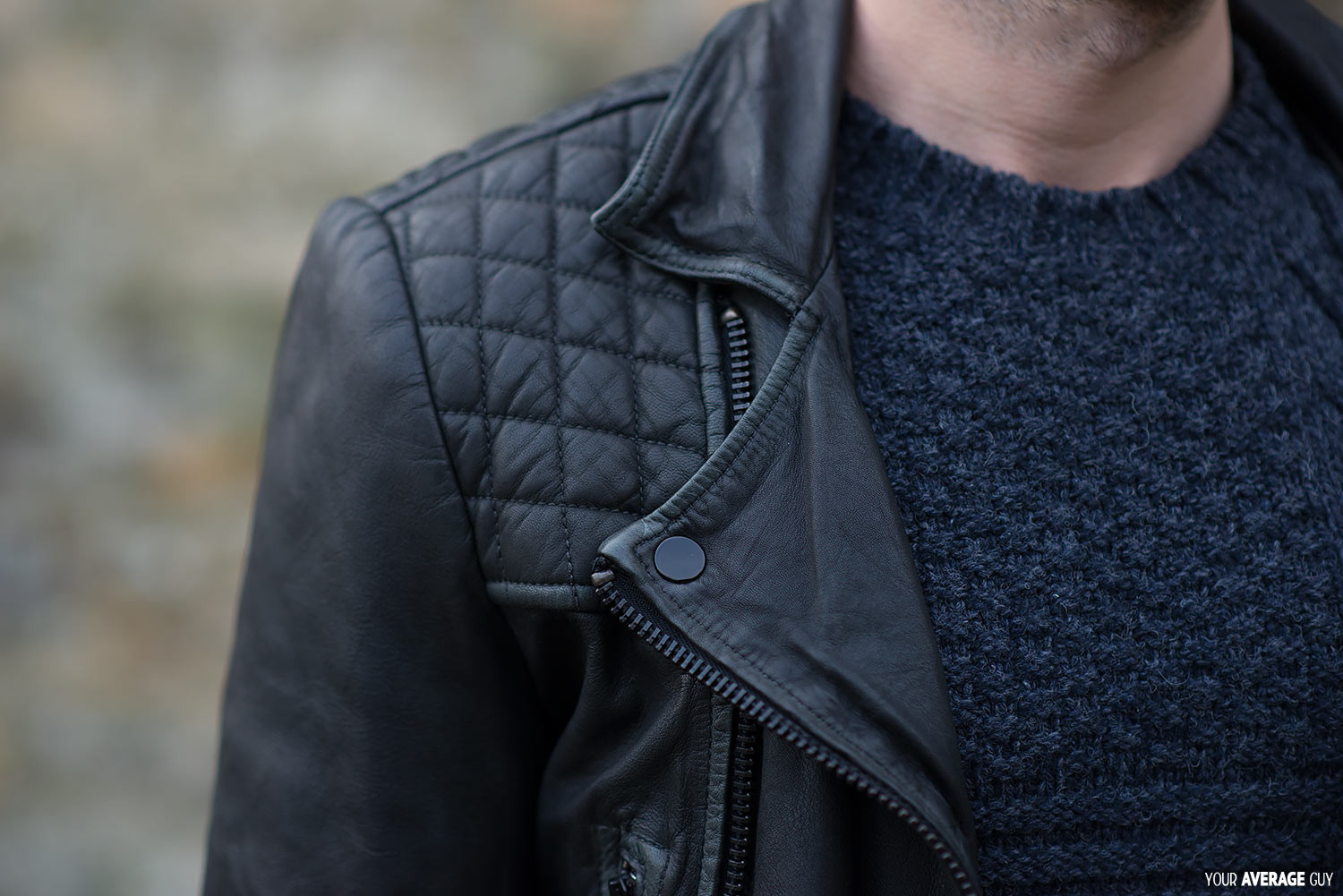 Close-up of the distressed leather and lapel of the AllSaints Cargo biker jacket mens