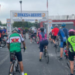 Bikes and beers event start line, emphasizing the social aspect of cycling and post-ride beer