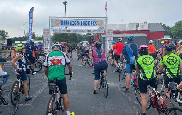 Bikes and beers event start line, emphasizing the social aspect of cycling and post-ride beer