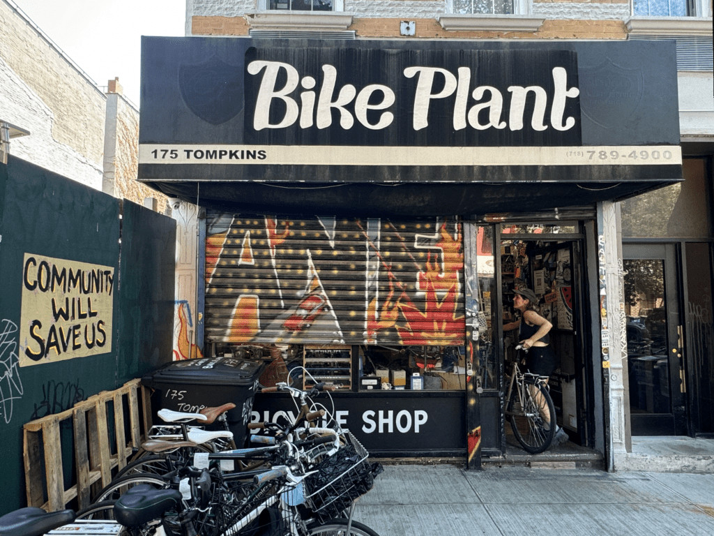 The storefront of Bike Plant in Bed-Stuy, Brooklyn, showcasing its welcoming community bike repair shop.