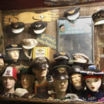 display case of collectibles-military hats