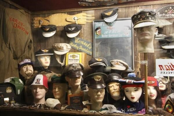 display case of collectibles-military hats