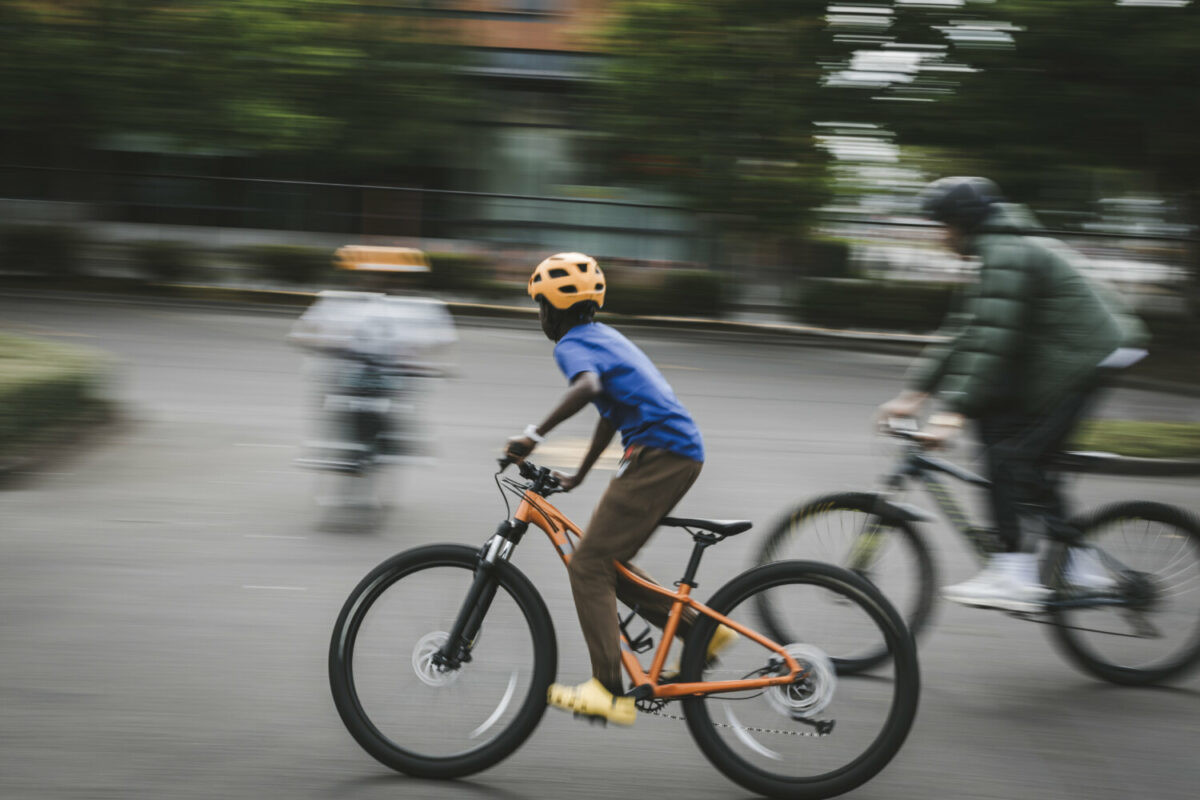 Group of boys mountain biking on a trail