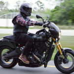 Rider on the Buell Super Cruiser prototype during Daytona Bike Week showcasing the bike's aggressive stance and powerful engine