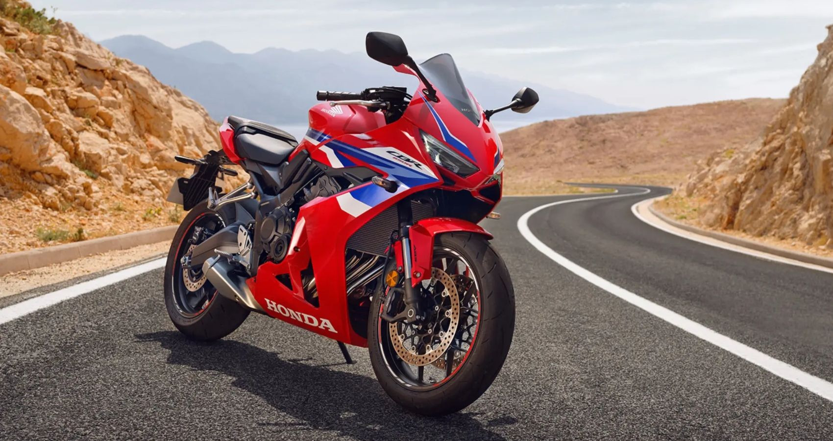 Front view of the Honda CBR650R, highlighting its aggressive sport bike styling and inline-four engine