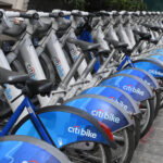 A row of Citi Bikes ready for rental in New York City, highlighting the accessibility of the bike-sharing service.