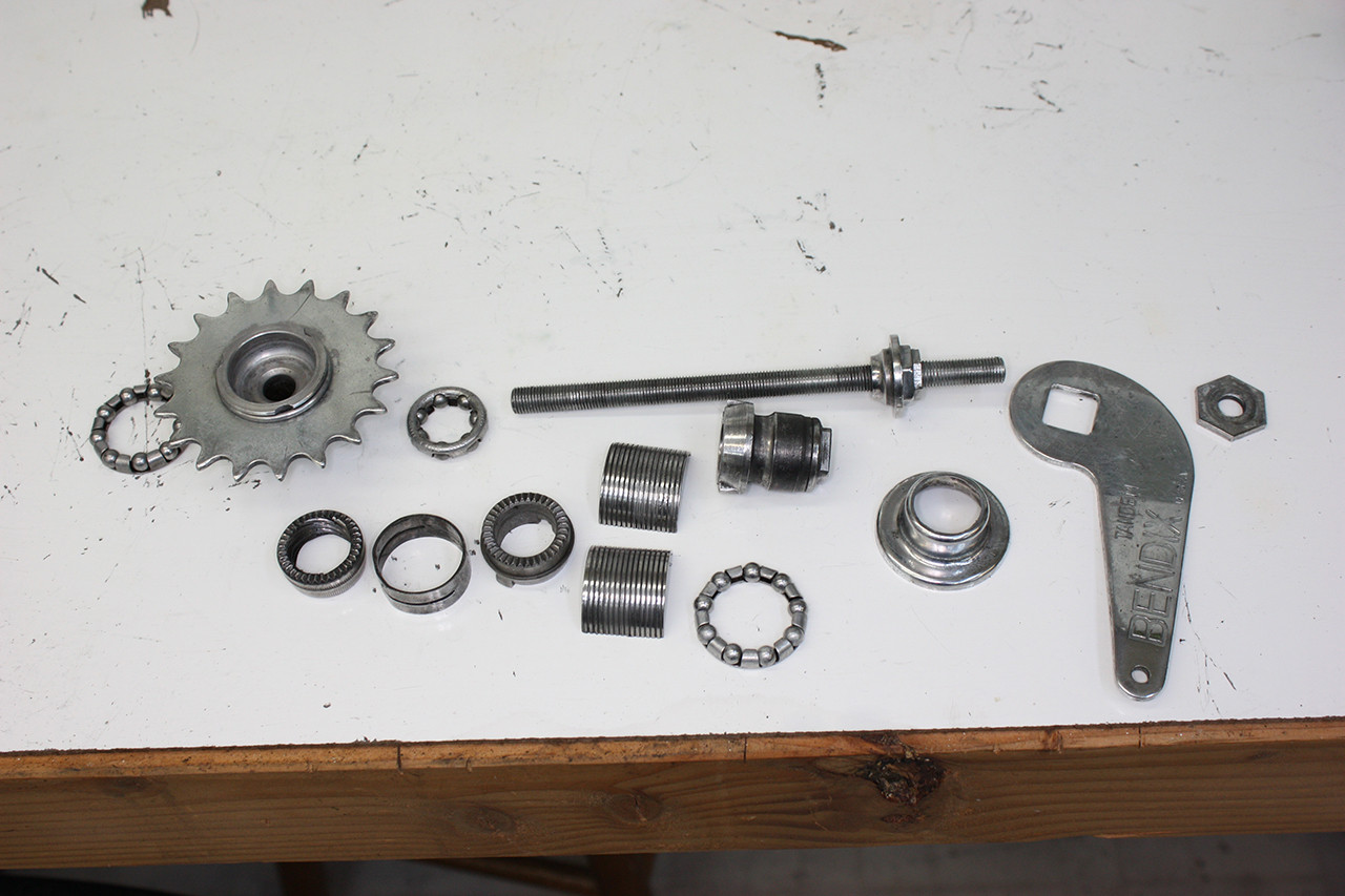 Cleaned and polished coaster brake components of the Schwinn Twinn Tandem, ready for reassembly and installation.