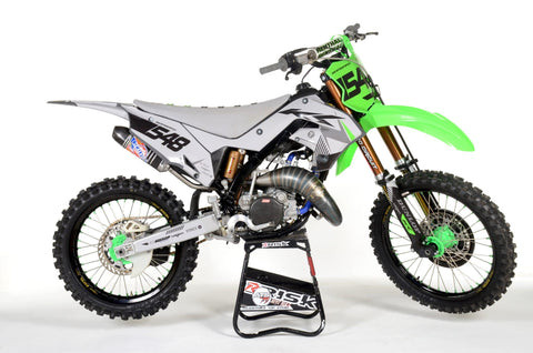 Dirt Bike on a moto stand, showcasing maintenance and readiness for riding.