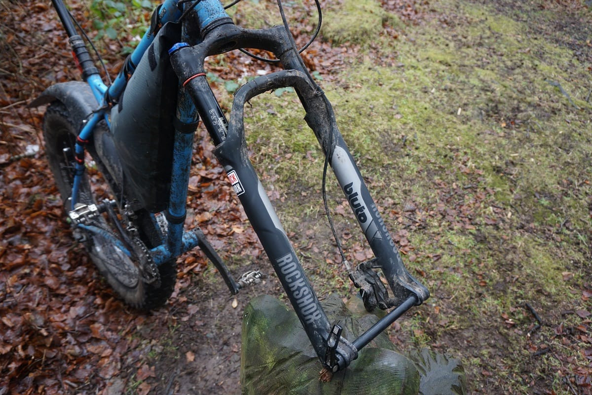 RockShox Bluto fork detached from a fat bike, highlighting its components and construction