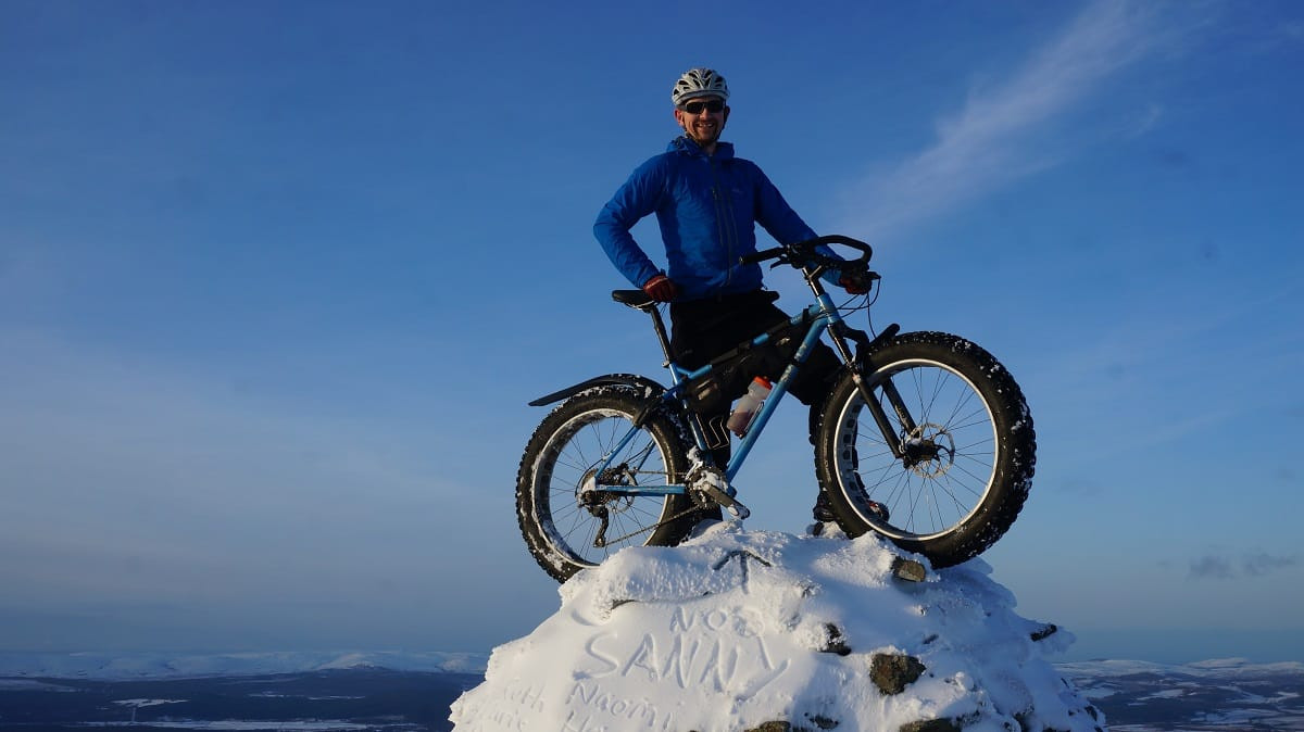 Hero shot of a rider with RockShox Bluto equipped fat bike, emphasizing its role in adventurous cycling