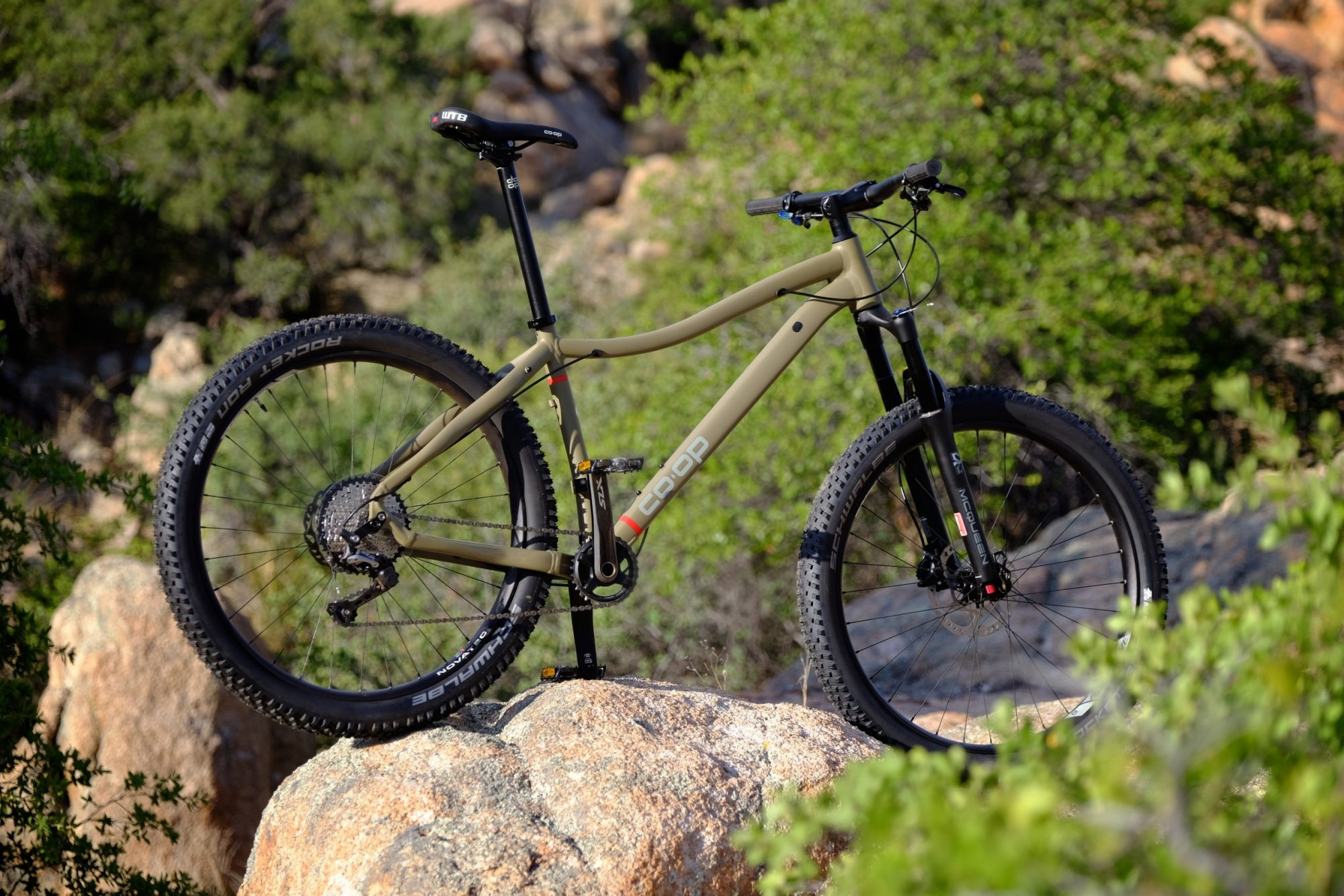 REI Co-op DRT 2.1 in its element, navigating a rocky trail and demonstrating its off-road capabilities.