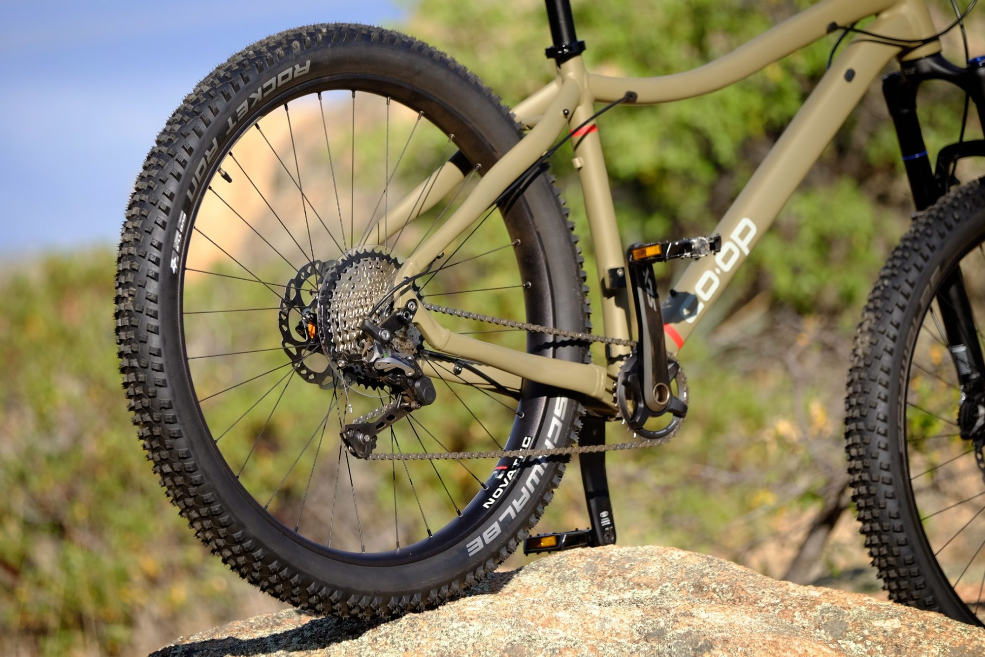 REI Co-op DRT 2.1 mountain bike ready for adventure, highlighting its robust frame and components.