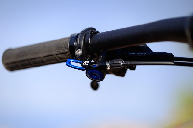 Front view of the REI Co-op DRT 2.1, focusing on the handlebar and controls, including the X Fusion lockout lever.