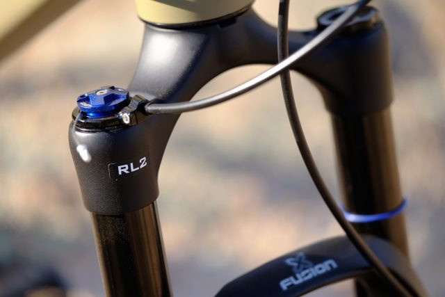 Close-up of the X Fusion McQueen fork on the REI Co-op DRT 2.1, emphasizing its features and adjustability.