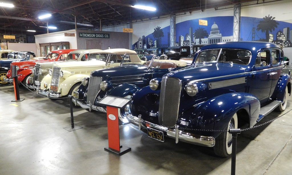 1937 Cadillac Series 60 Sedan and 1936 Ford Roadster showcasing 1930s automotive design