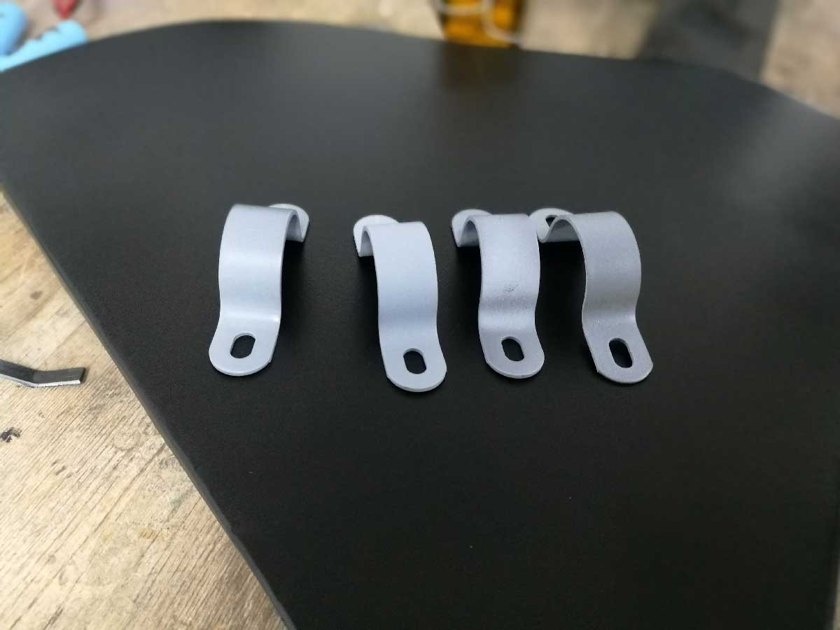Radiator mounting for the e-bike water cooling system, positioned horizontally for efficient cooling and a motorcycle-inspired look