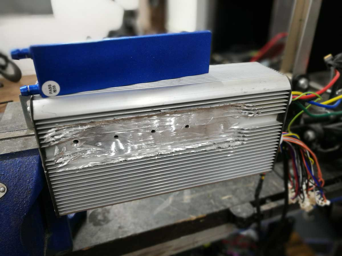 Preparing the e-bike controller for water cooling by creating a flat surface for the water block