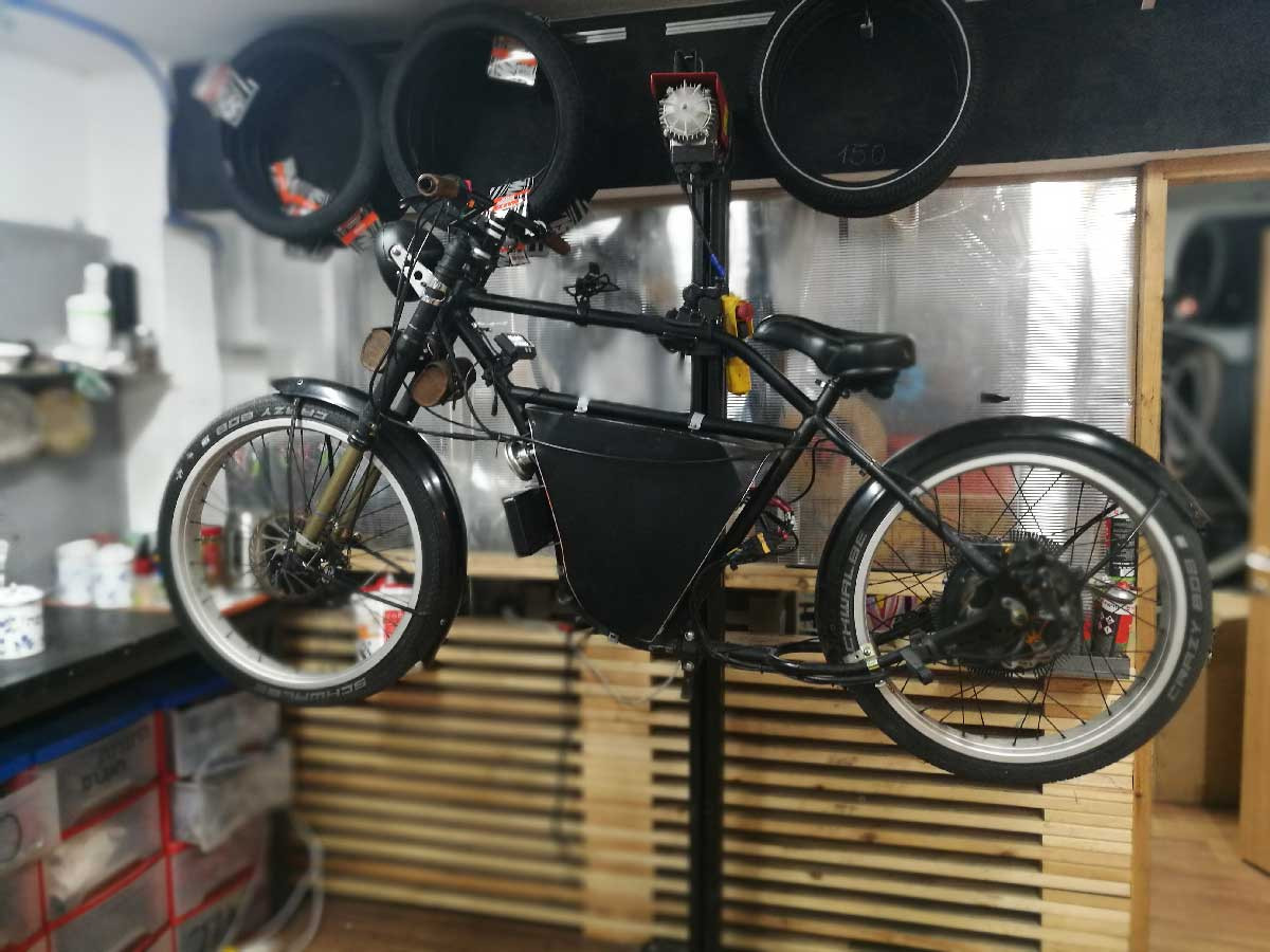 Porsche e-bike frame upgraded with a PC water cooling system for the controller, demonstrating the DIY cooling setup