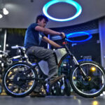 Inside an e-bike shop showcasing various electric bikes and components