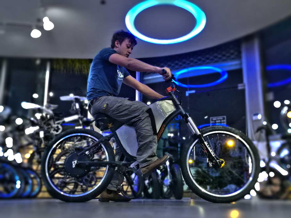 Inside an e-bike shop showcasing various electric bikes and components