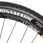 Close-up of a 26-inch mountain bike tire and rim showing the tread pattern and rim detail