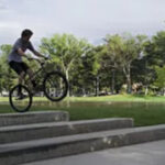 FOAD bike crew members Sam Allgood, Jackson Bradshaw, Parker Thompson, and Izik and Evan Service pose with their fixie bikes at Liberty Park, showcasing urban fixed gear freestyle culture.