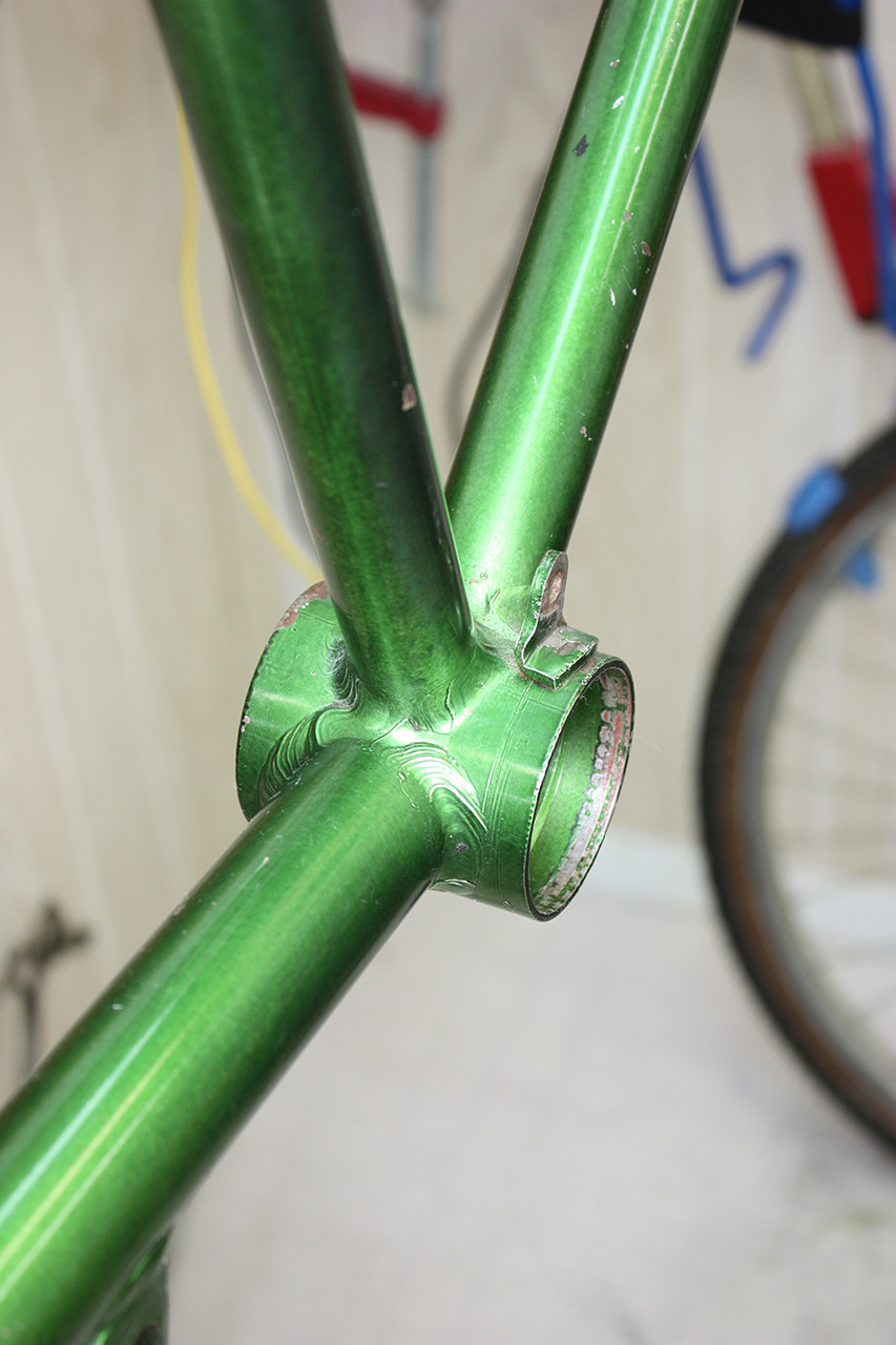 Bottom bracket area of the Steve Schwinn bike frame after polishing, showcasing the improved condition.