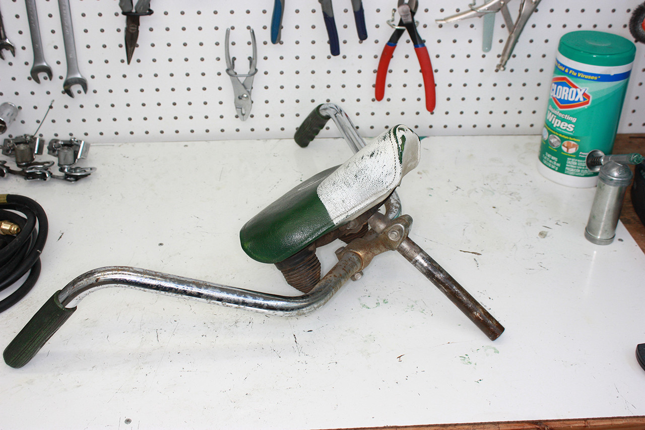 Front seat post and rear handlebars of the Schwinn Twinn Tandem before cleaning, showing rust and wear.