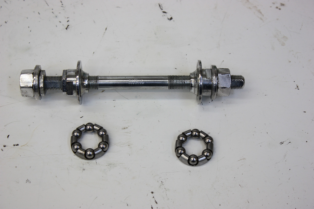 Front wheel axle of the Steve Schwinn bike polished to a shine, highlighting the restoration of components.
