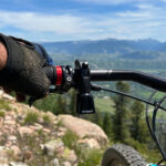 Close-up of Timber Quick Release Mountain Bike Bell on handlebar, ideal bike gift for mountain bikers