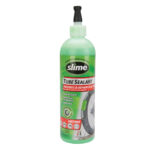 bottle of green slime bicycle tire sealant with valve removal tool cap