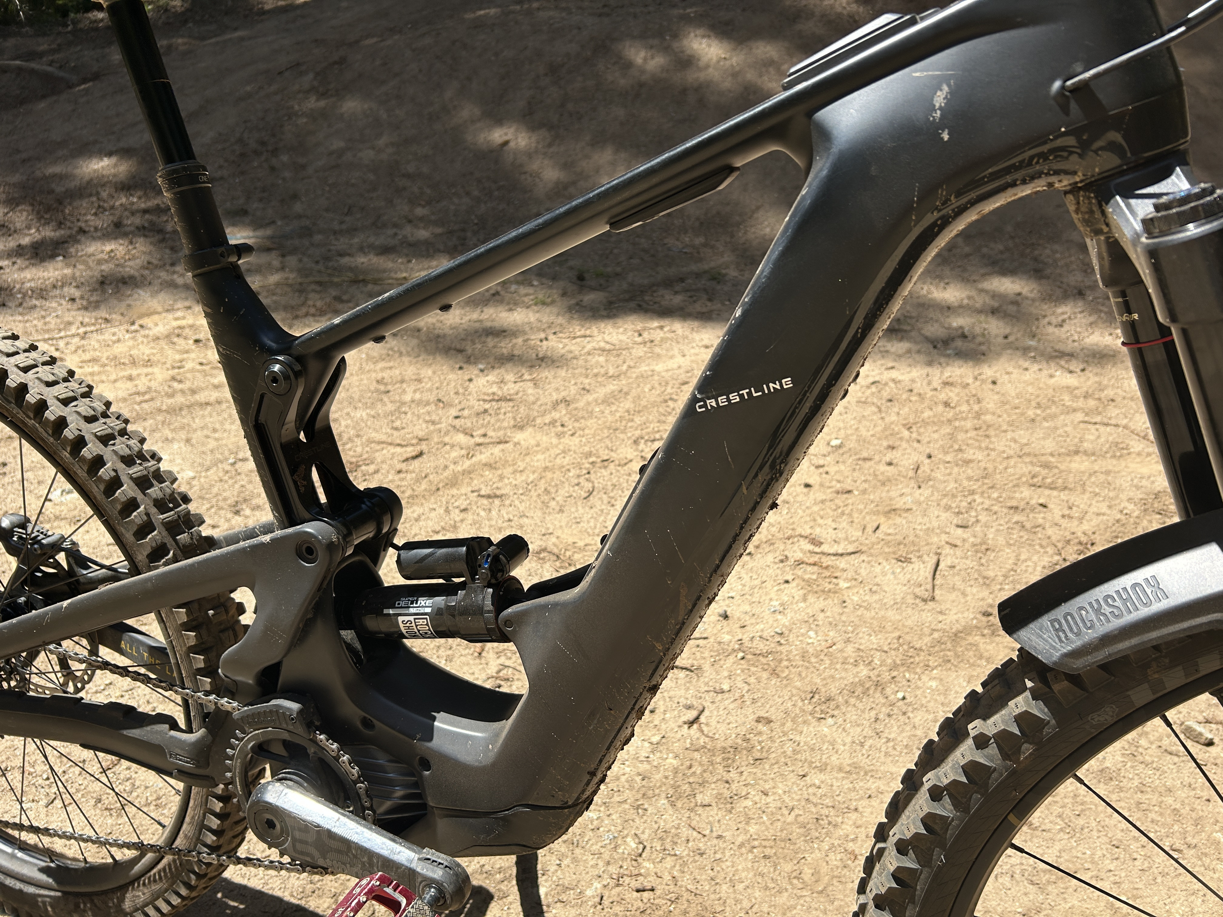 Action shot of Crestline e-bike riding on a trail