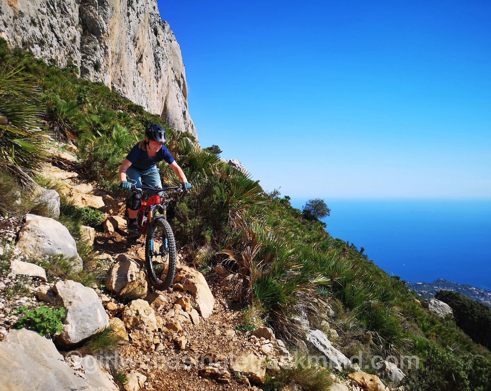 Mountain biker with Ibis Mojo 3 overlooking a mountain range