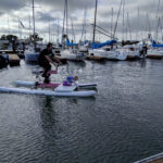 Brian McGuire and his daughter try out water-bikes at Bike Walk Alameda event
