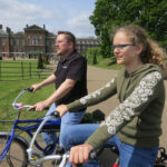 Scott and Lydia in front of Kensington Palace on a Fat Tire Bike Tour in London
