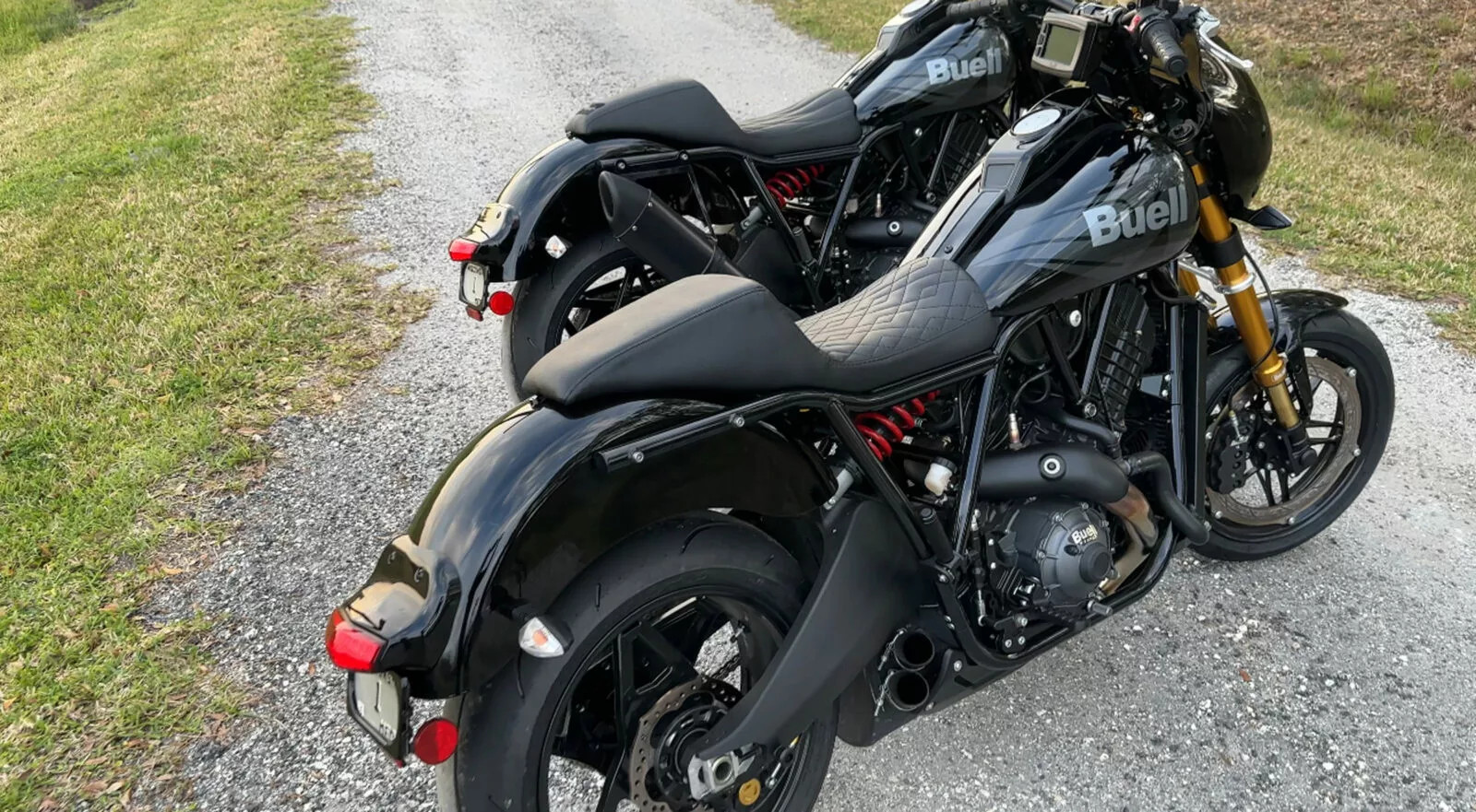 Close-up of the Buell Super Cruiser's powerful engine and exhaust system, showcasing the bike's performance heart
