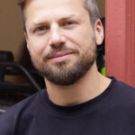 Mike Peregudov CEO of Whizz e-bikes rental in Manhattan, discussing urban mobility solutions.