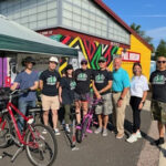 Mayor James Cahill visiting the New Brunswick Bike Exchange Bike Rodeo event with NBBX volunteers ensuring bicycle safety checks and community engagement.