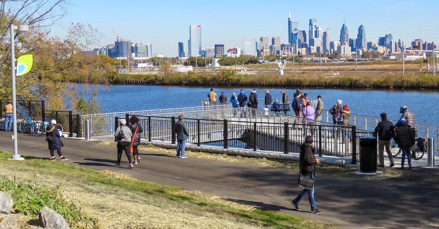 Cyclists pause at an overlook along the Schuylkill River Trail, enjoying panoramic views of Pennsylvania's natural beauty.
