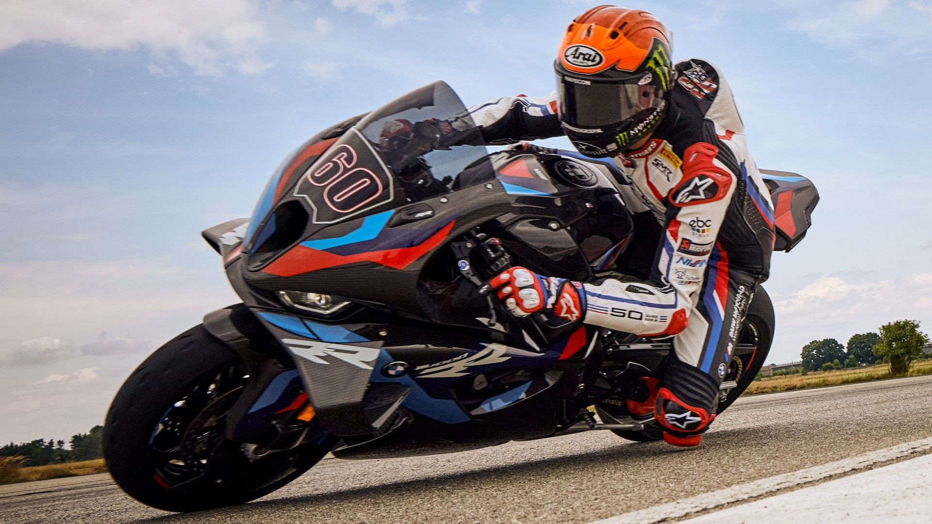 BMW M 1000 RR parked, showcasing its aggressive superbike styling, carbon fiber components, and M-series branding