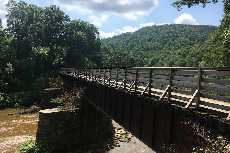 The Redbank Valley Rail Trail in Pennsylvania features a historic railroad bridge, highlighting the trail's heritage.